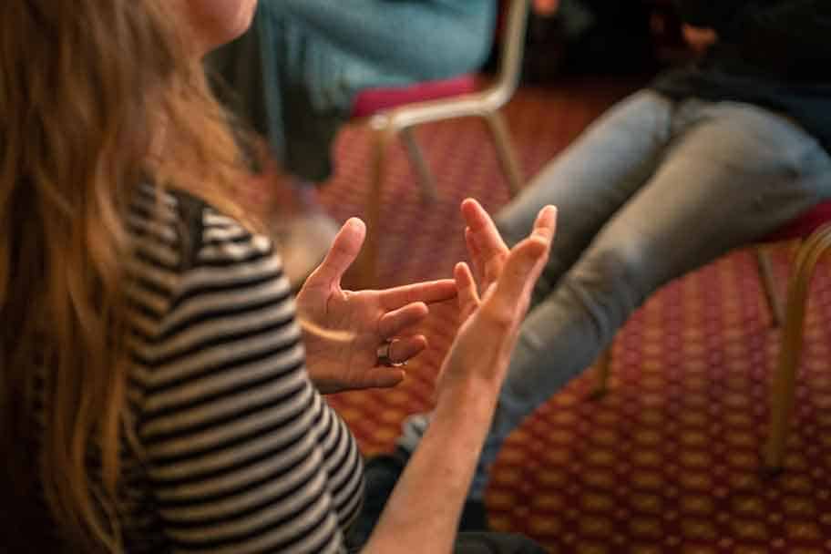 BSL First - woman signing